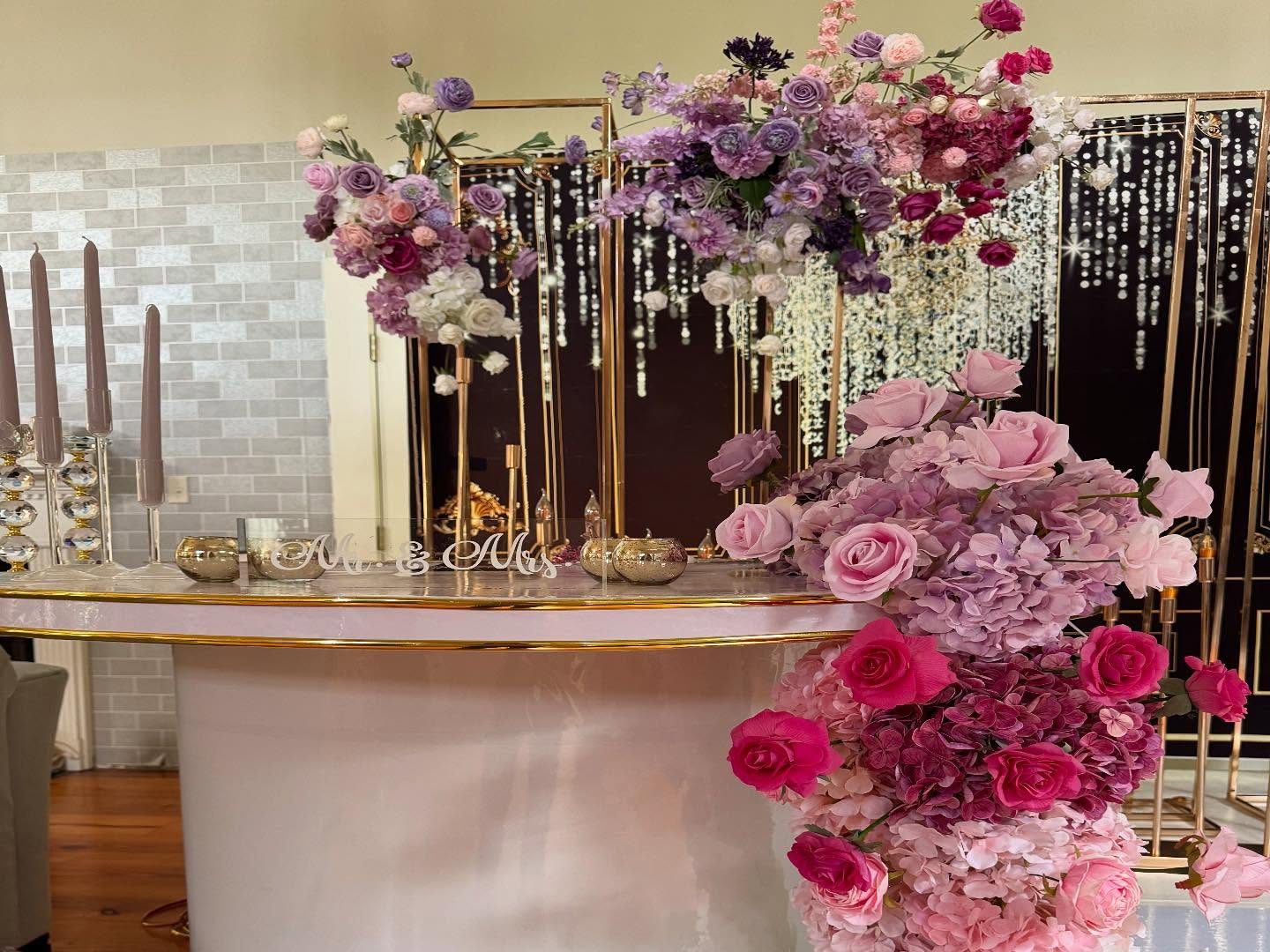 Mr and Mrs sweetheart bar installation with cascading pink and purple florals